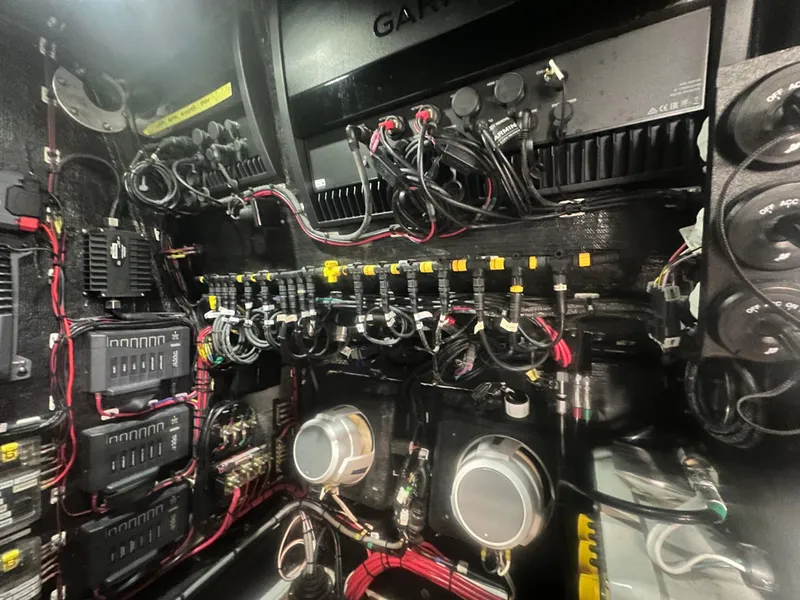 Slide: The Image of Electrical system inside a 2021 Yellowfin 36 Offshore boat, showcasing complex wiring and components. - 20