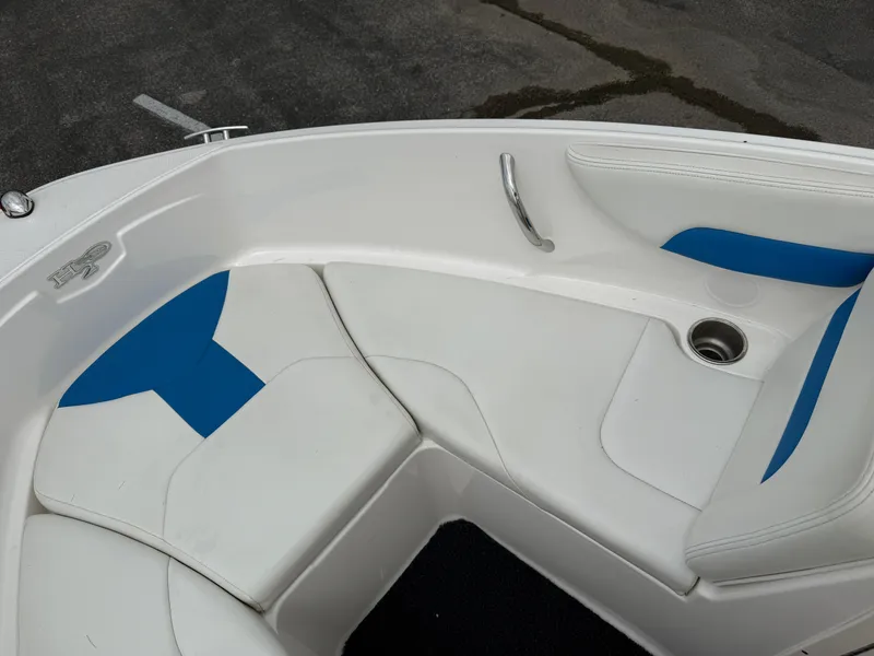 Slide: The Image of 2017 Chaparral 19 H2O Sport boat interior with white and blue seating. - 10