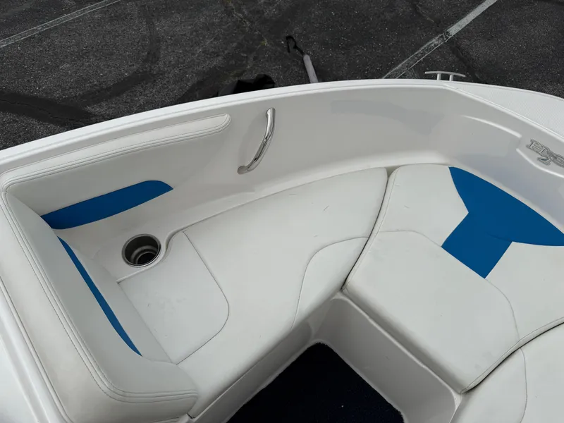 Slide: The Image of Interior view of 2017 Chaparral 19 H2O Sport boat with white and blue seating. - 11