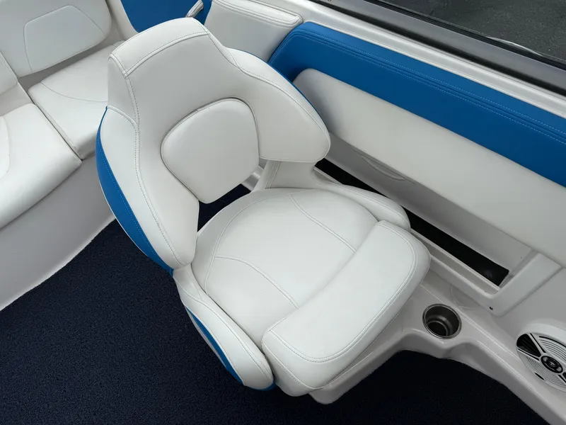 Slide: The Image of 2017 Chaparral 19 H2O Sport boat interior with white and blue seating. - 12