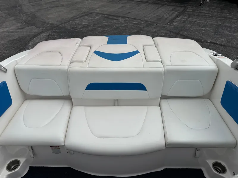 Slide: The Image of 2017 Chaparral 19 H2O Sport boat interior with white and blue seating. - 14