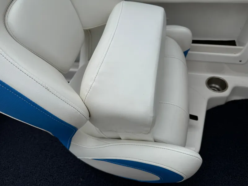 Slide: The Image of White and blue seat in 2017 Chaparral 19 H2O Sport boat interior. - 15