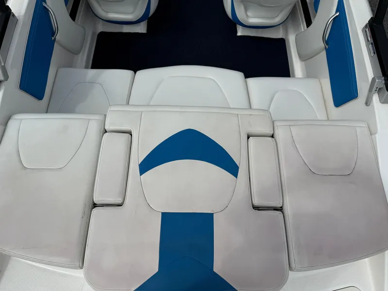 Slide: The Image of 2017 Chaparral 19 H2O Sport boat interior with white and blue seating. - 24