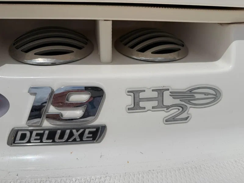 Slide: The Image of 2017 Chaparral 19 H2O Sport Deluxe emblem on boat exterior. - 28