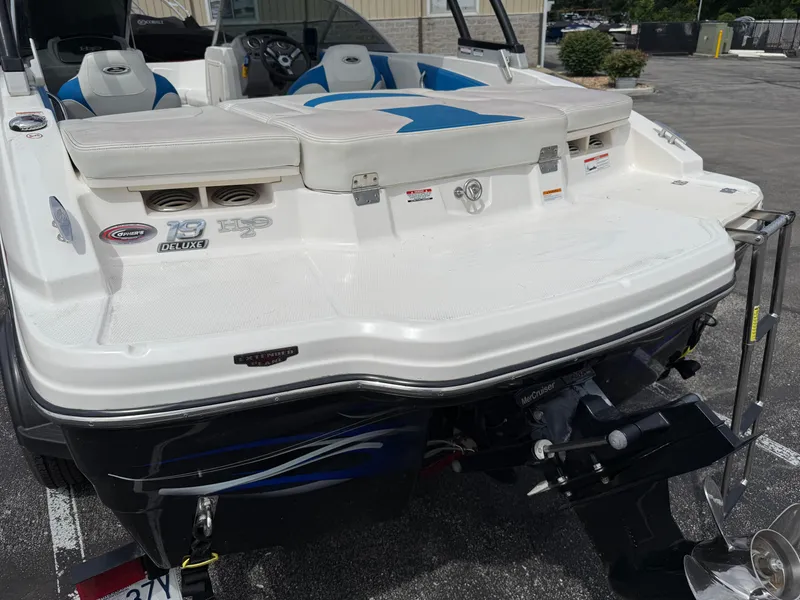 Slide: The Image of 2017 Chaparral 19 H2O Sport boat, rear view with swim platform and outboard motor. - 29