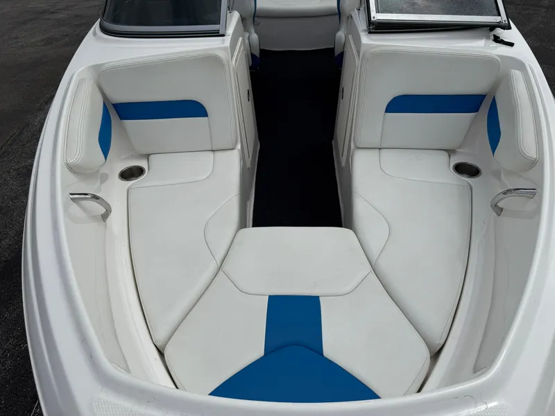 Slide: The Image of 2017 Chaparral 19 H2O Sport boat interior with white and blue seating. - 32
