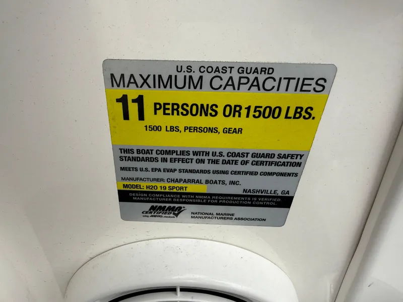 Slide: The Image of 2017 Chaparral 19 H2O Sport capacity label: 11 persons or 1500 lbs, U.S. Coast Guard compliant. - 7