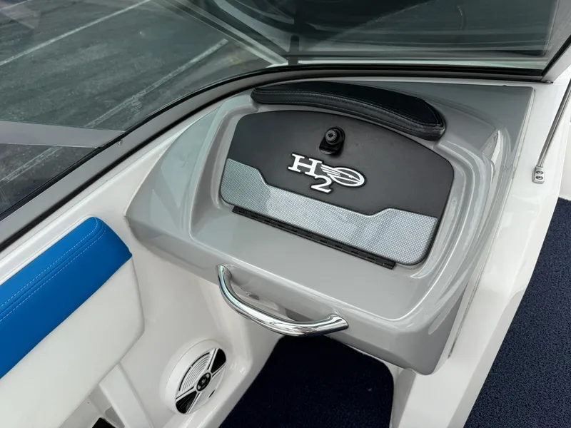 Slide: The Image of Interior view of 2017 Chaparral 19 H2O Sport boat dashboard with H2O logo. - 8