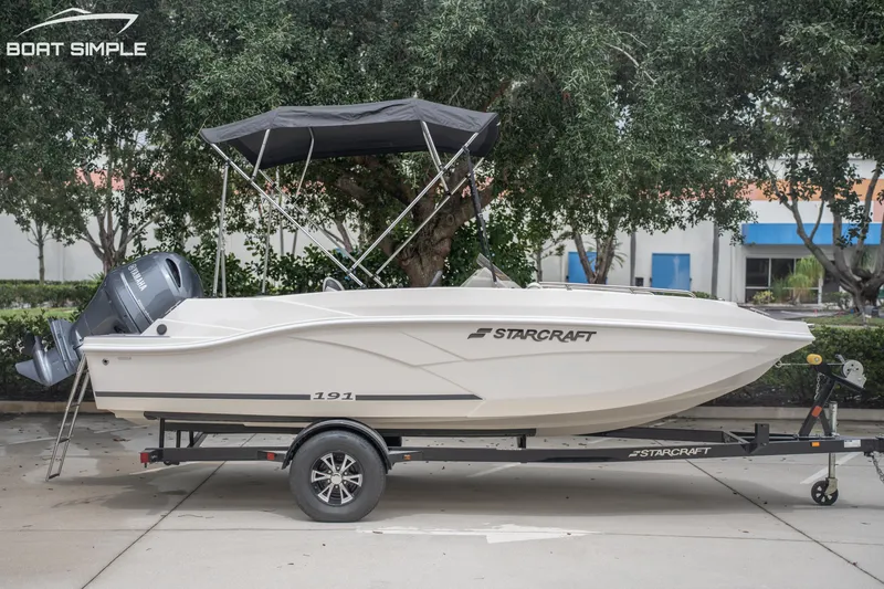 Slide: The Image of 2024 Starcraft SVX 191 OB boat on trailer, side view, with Yamaha outboard motor. - 1