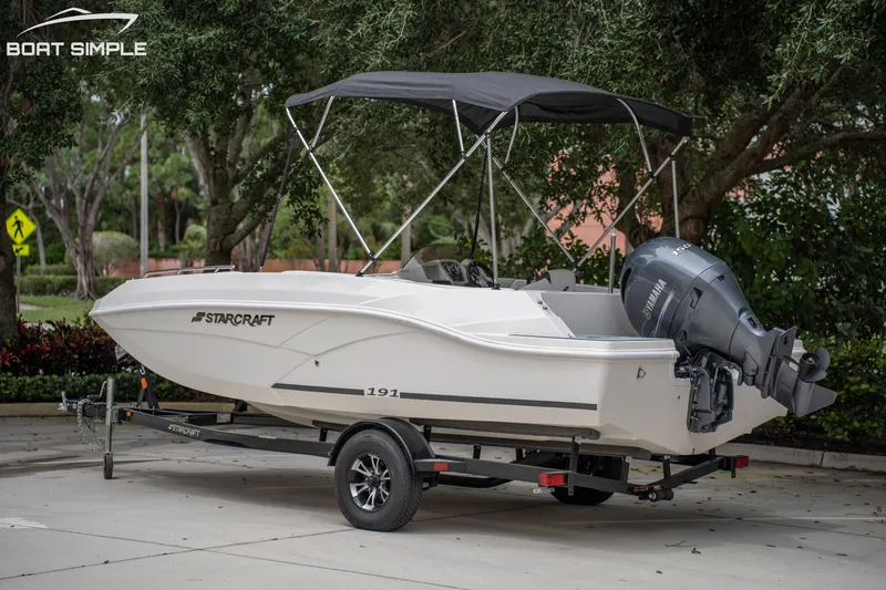 Slide: The Image of 2024 Starcraft SVX 191 OB boat on trailer, featuring Yamaha outboard motor. - 3
