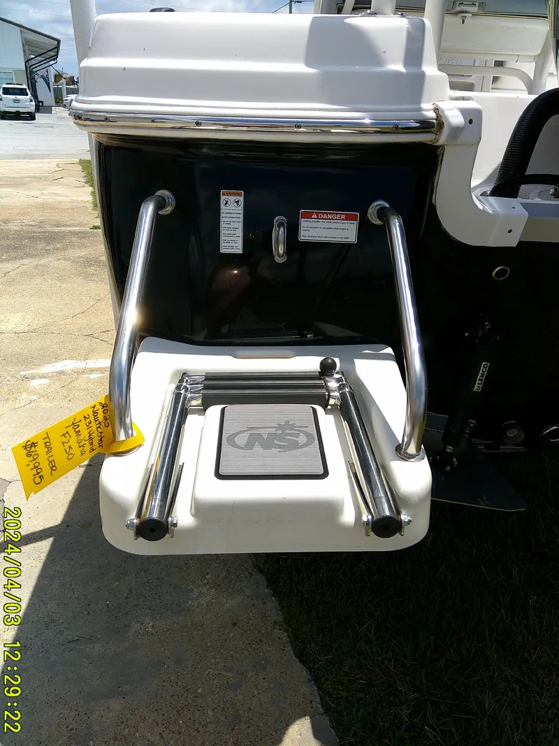 Slide: The Image of 2023 NauticStar 231 Hybrid boat with swim platform and ladder. - 10