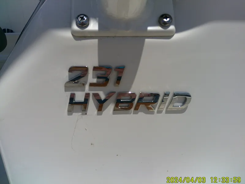 Slide: The Image of 2023 NauticStar 231 Hybrid boat emblem with chrome lettering. - 30