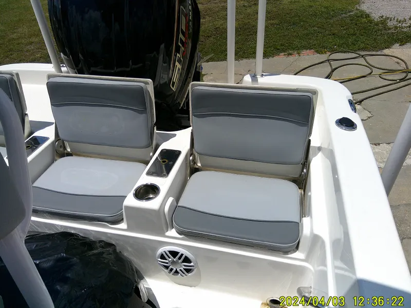 Slide: The Image of 2023 NauticStar 231 Hybrid boat seats with cup holders and speaker. - 45
