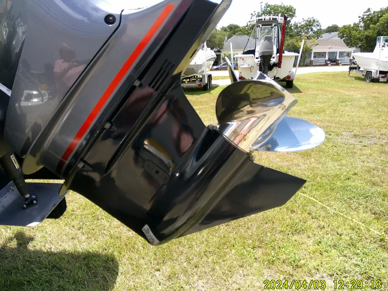 Slide: The Image of 2023 NauticStar 231 Hybrid boat propeller on display outdoors. - 9
