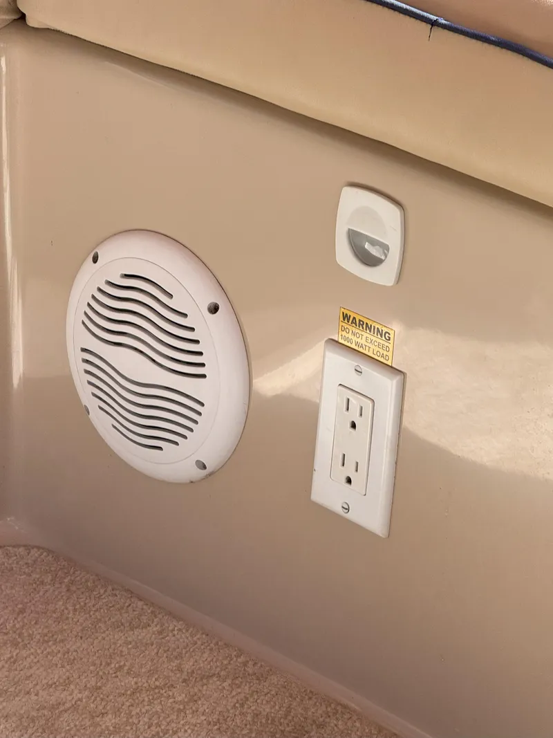 Slide: The Image of Speaker and outlet on 2008 Duffy Snug Harbor 18 boat interior. - 10