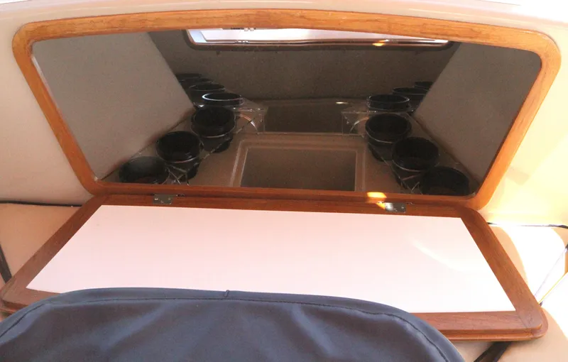 Slide: The Image of Interior of 2008 Duffy Snug Harbor 18 boat with wooden trim and cup holders. - 7