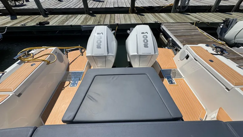 Slide: The Image of 2024 Nimbus W11 boat with twin Mercury 300 engines at dock. - 11