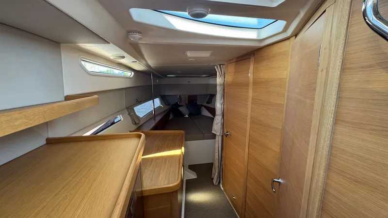 Slide: The Image of Luxurious interior of 2024 Nimbus W11 yacht with wooden finishes and skylight. - 29