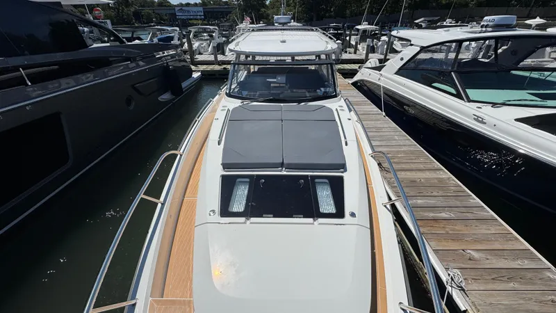 Slide: The Image of 2024 Nimbus W11 yacht docked at a marina, showcasing sleek design and modern features. - 38