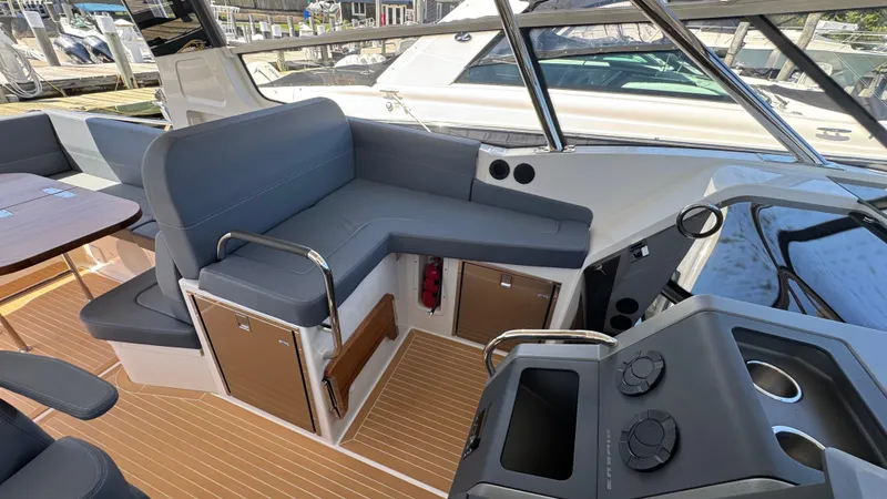 Slide: The Image of 2024 Nimbus W11 boat interior with sleek seating and modern controls. - 19