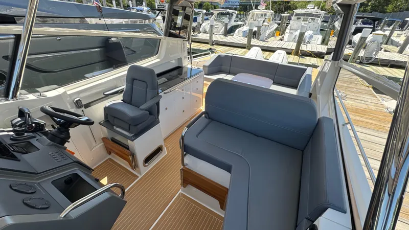 Slide: The Image of Luxurious interior of 2024 Nimbus W11 boat with modern seating and sleek design. - 20