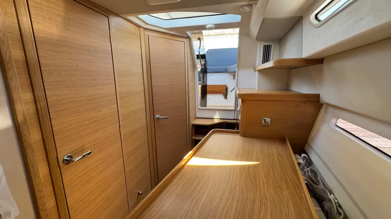 Slide: The Image of 2024 Nimbus W11 interior with wooden cabinetry and modern design elements. - 32
