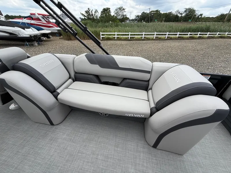 Slide: The Image of 2025 Sylvan L3 Party Fish boat seating with gray upholstery and modern design. - 14
