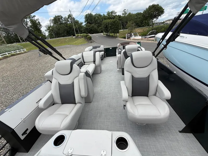 Slide: The Image of 2025 Sylvan L3 Party Fish boat interior with plush seating and modern design. - 15