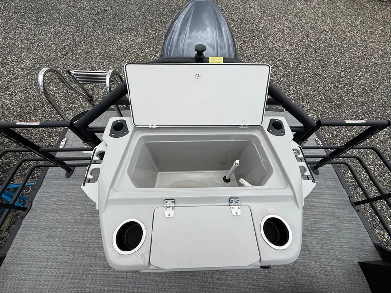 Slide: The Image of 2025 Sylvan L3 Party Fish boat with open storage compartment and cup holders. - 7