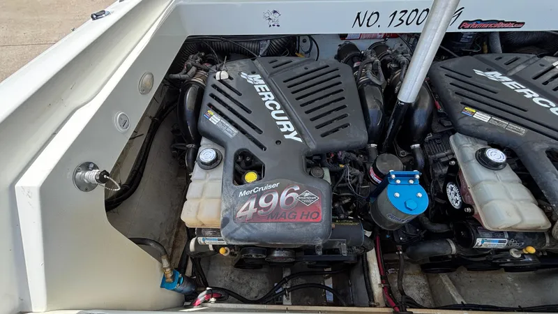 Slide: The Image of 2005 Baja 33 Outlaw boat engine compartment with twin Mercury 496 MAG HO engines. - 29