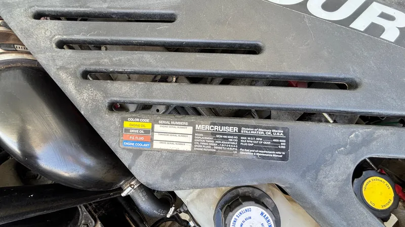 Slide: The Image of Engine cover of a 2005 Baja 33 Outlaw with MerCruiser label and color codes. - 32