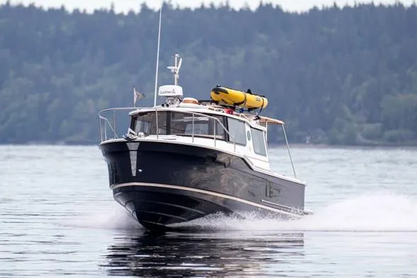 Slide: The Image of Manufacturer Provided Image: 2024 Ranger Tugs R-27 boat cruising on a lake. - 48