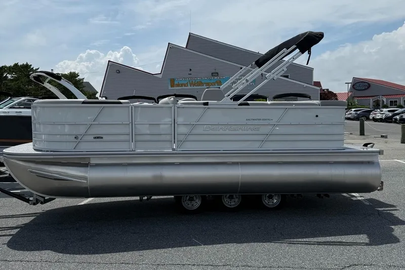 The Image of 2025 Berkshire 20CL LE 2.75 pontoon boat parked outdoors, side view. - 1