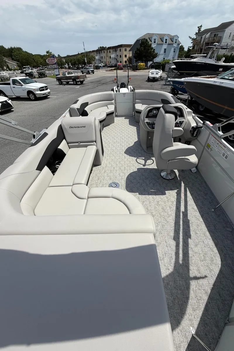 Slide: The Image of 2025 Berkshire 20CL LE 2.75 pontoon boat with spacious seating and modern design. - 10