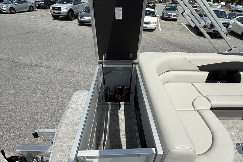 Slide: The Image of Open storage compartment on a 2025 Berkshire 20CL LE 2.75 pontoon boat. - 11