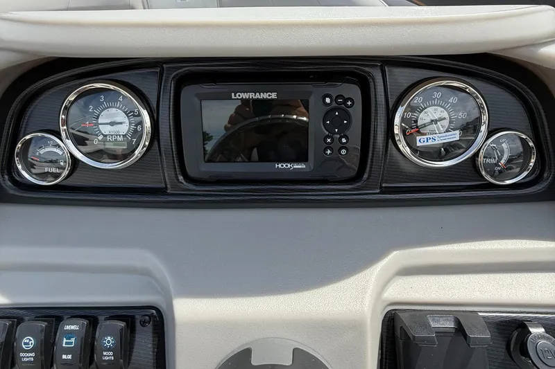 Slide: The Image of Dashboard of 2025 Berkshire 20CL LE 2.75 with gauges and Lowrance GPS system. - 16