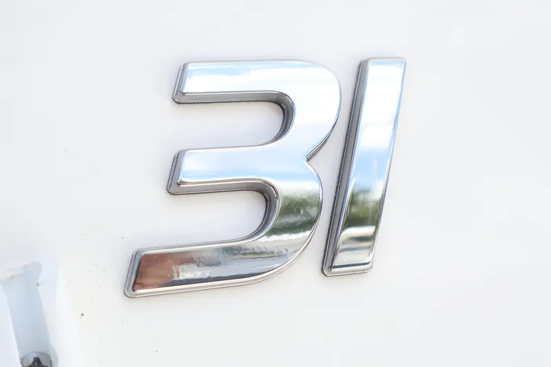 Slide: The Image of Chrome "31" emblem on 2025 Regulator model boat. - 10