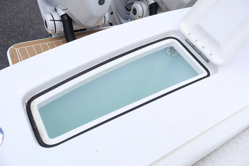 Slide: The Image of Livewell on 2025 Regulator 31 boat, open lid, clean water inside. - 19