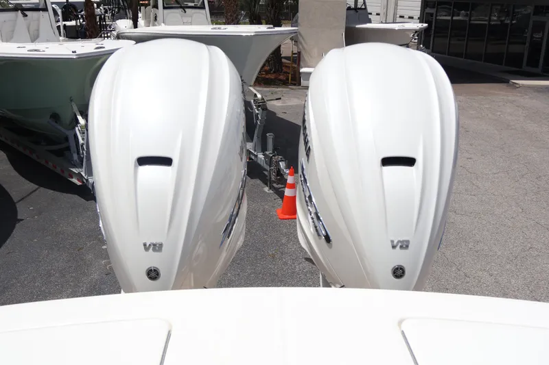 Slide: The Image of 2025 Regulator 31 boat with dual V8 outboard engines, displayed outdoors. - 20