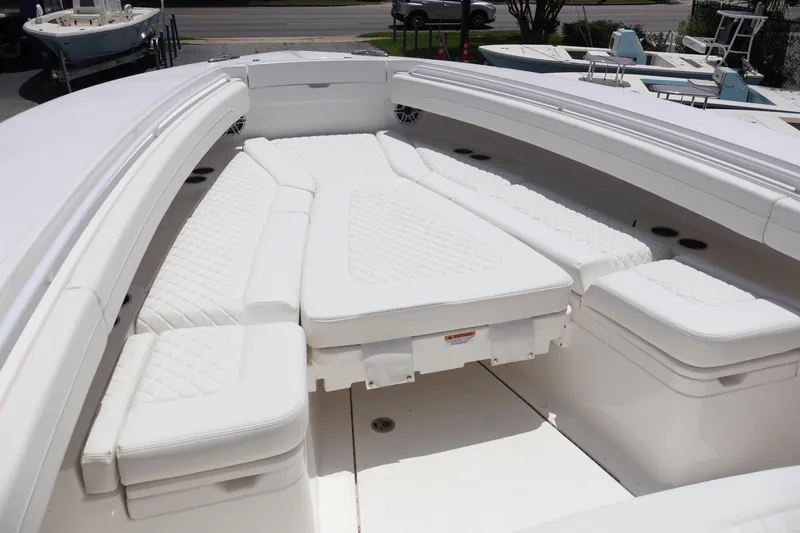 Slide: The Image of 2025 Regulator 31 boat with white cushioned seating in the bow area. - 3