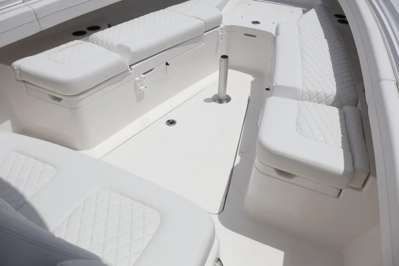 Slide: The Image of Luxurious seating area on 2025 Regulator 31 boat with white cushioned seats. - 6