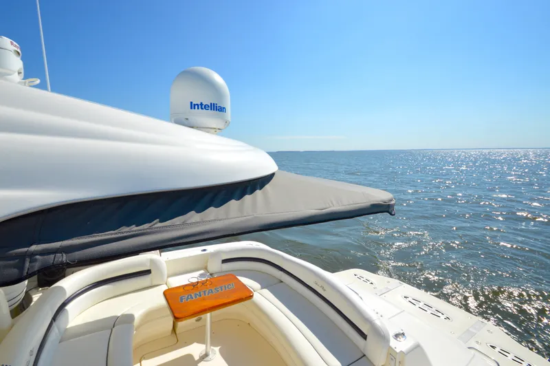 Slide: The Image of 2008 Sea Ray 44 Sundancer yacht on open water, featuring Intellian satellite dome. - 10