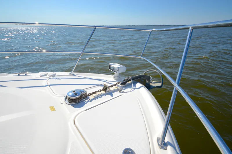 Slide: The Image of Bow of 2008 Sea Ray 44 Sundancer yacht on open water, sunny day. - 22