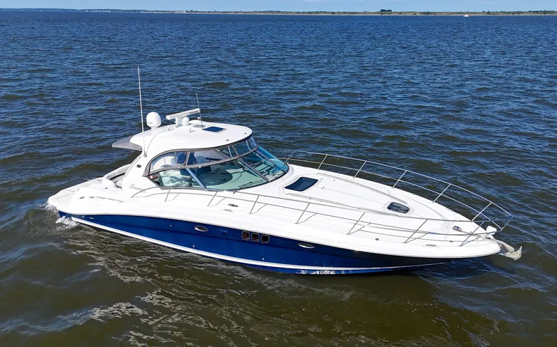 Slide: The Image of 2008 Sea Ray 44 Sundancer yacht cruising on open water. - 5