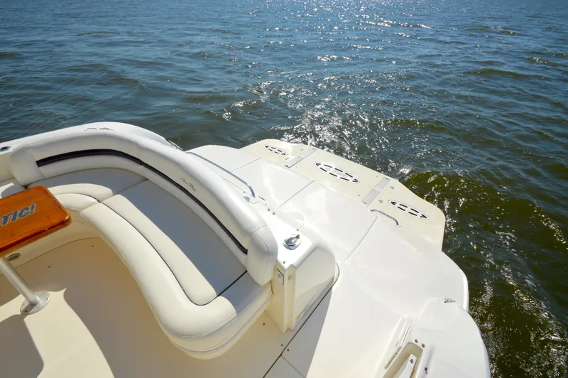 Slide: The Image of 2008 Sea Ray 44 Sundancer boat with white seating, cruising on open water. - 9