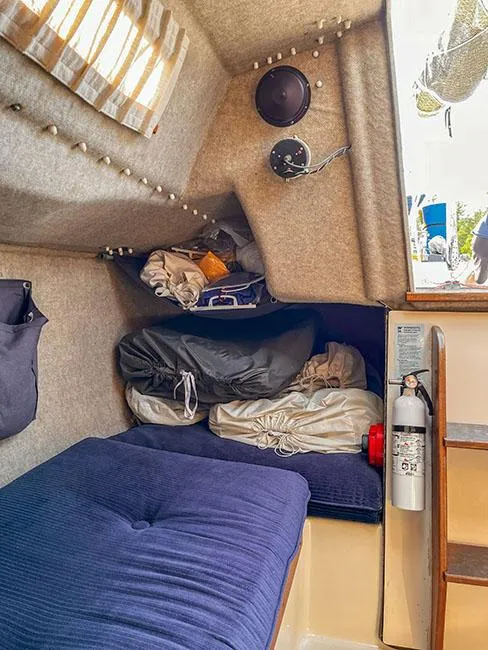 Slide: The Image of Cozy cabin interior of 1982 S2 7.9 sailboat with cushions and storage. - 16