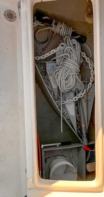 Slide: The Image of Storage compartment on a 1982 S2 7.9 sailboat with ropes and equipment. - 19