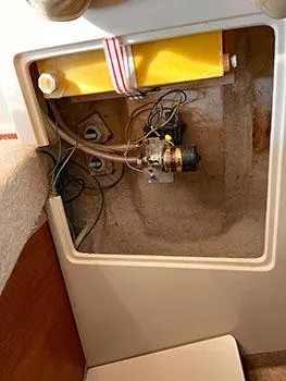 Slide: The Image of Interior view of 1982 S2 7.9 sailboat showing storage compartment with wiring and equipment. - 20