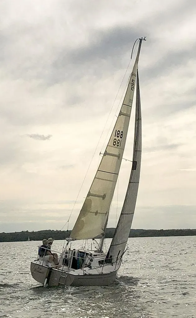 Slide: The Image of Sailboat S2 7.9 (1982) navigating on a cloudy day, with sails fully extended. - 6