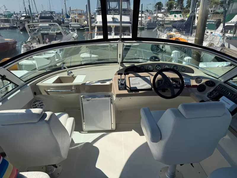 Slide: The Image of Interior cockpit of a 2006 Carver 36 Mariner yacht with steering wheel and navigation equipment. - 11